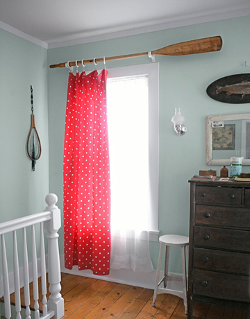 red polka dot curtain hung on paddle