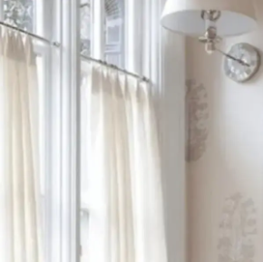 white curtains hung on tension rods
