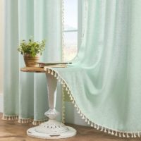 mint green curtains with white tassles