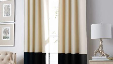 black and cream curtains hanging in living room