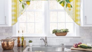 lemon kitchen curtain valance and tier with lemon print, hanging on rod in kitchen